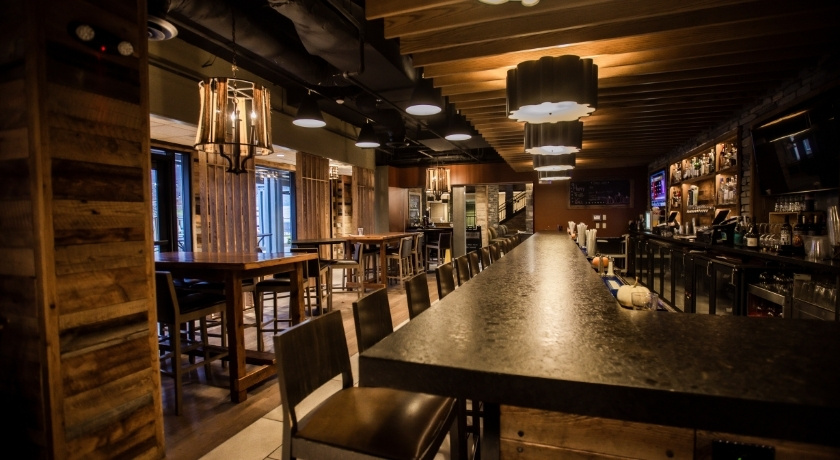 Preston's Restaurant bar & high-top seating area with TV's