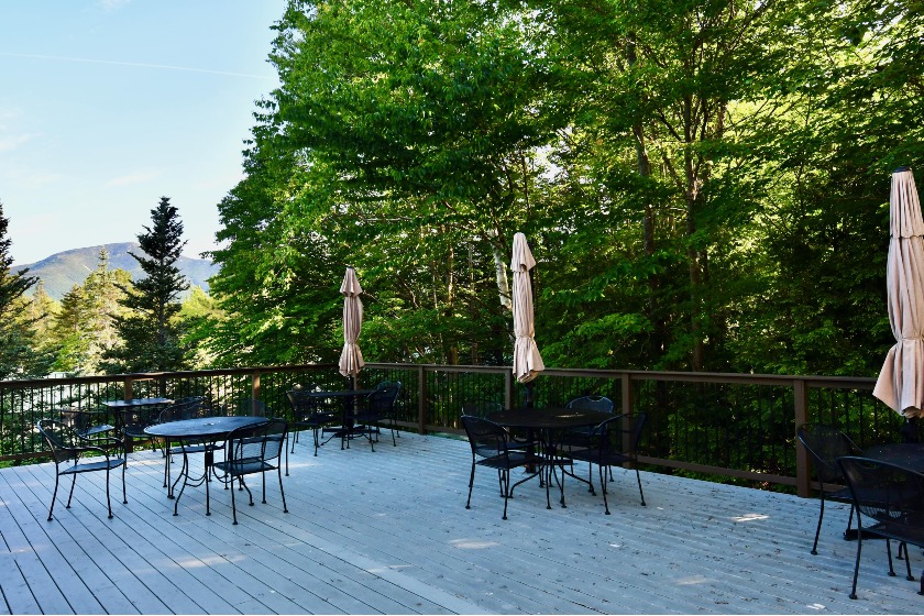 Sit back & relax on our expansive deck overlooking the mountains.